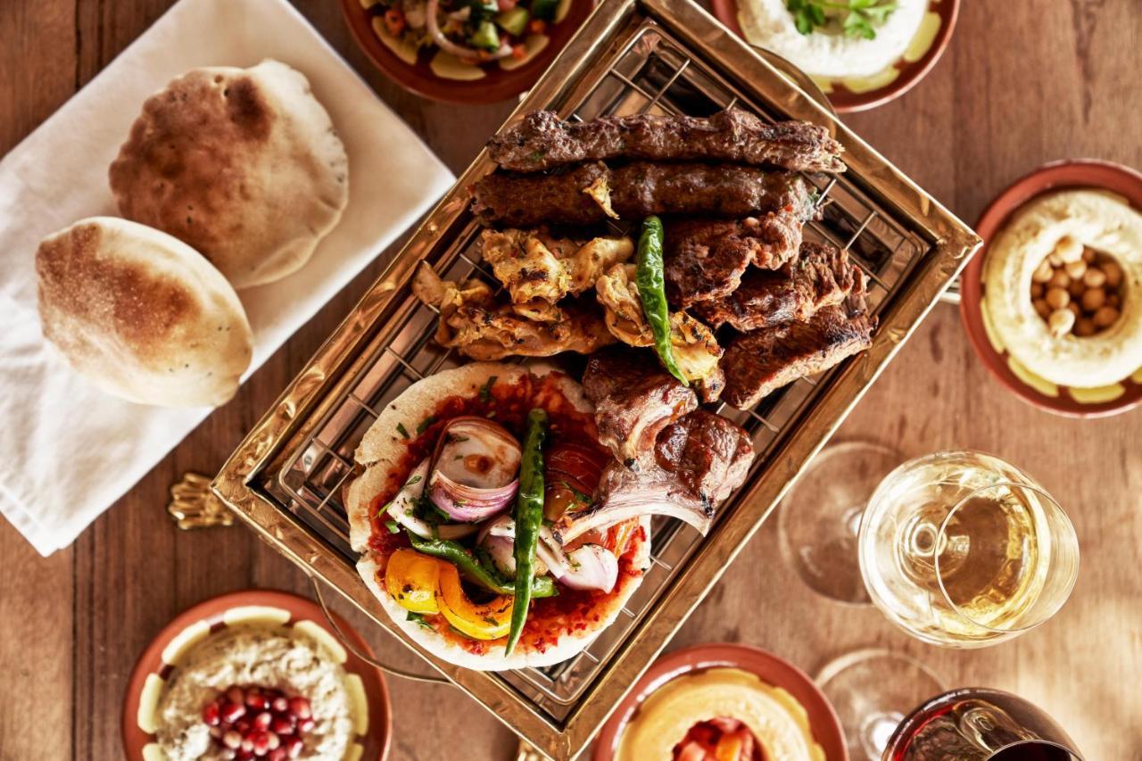 Fanar Hotel & Residences Salalah Esterno foto A selection of Middle Eastern cuisine